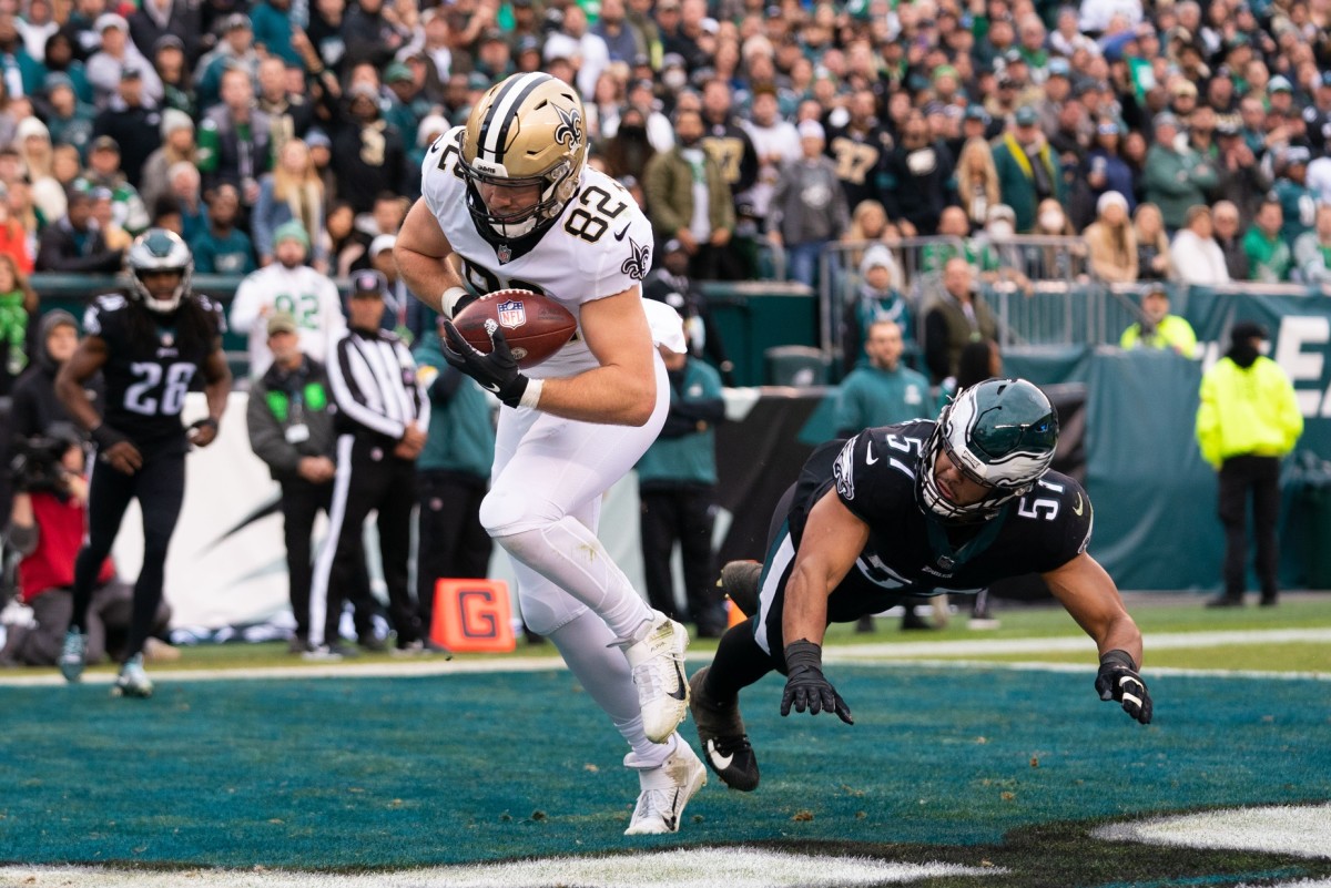 New Orleans Saints tight end Adam Trautman (82) makes a touchdown catch past Eagles linebacker T.J. Edwards (57). Mandatory Credit: Bill Streicher-USA TODAY Sports